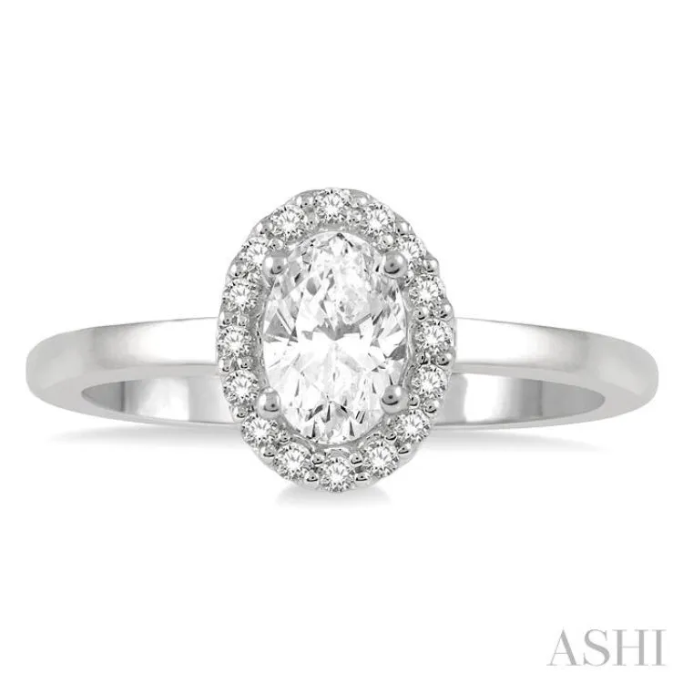 1/3 Ctw Round Cut Diamond Halo Engagement Ring With 1/4 ct Oval Cut Center Stone in 14K White Gold