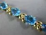 ESTATE WIDE & LONG 14CT AAA BLUE TOPAZ 14KT YELLOW GOLD 3D LEAF TENNIS BRACELET