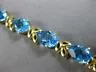 ESTATE WIDE & LONG 14CT AAA BLUE TOPAZ 14KT YELLOW GOLD 3D LEAF TENNIS BRACELET