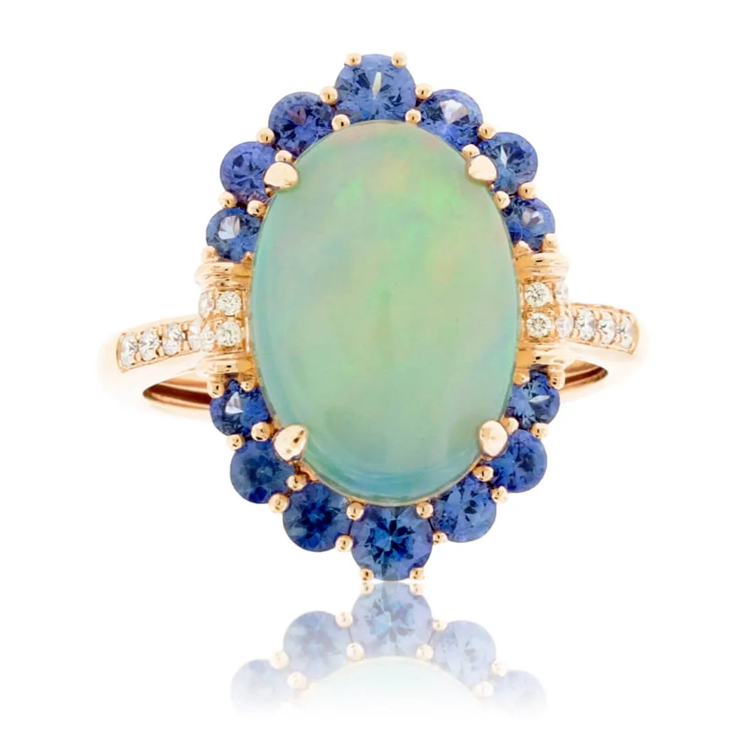 Oval Cabochon Opal Ring with Sapphire & Diamond Halo