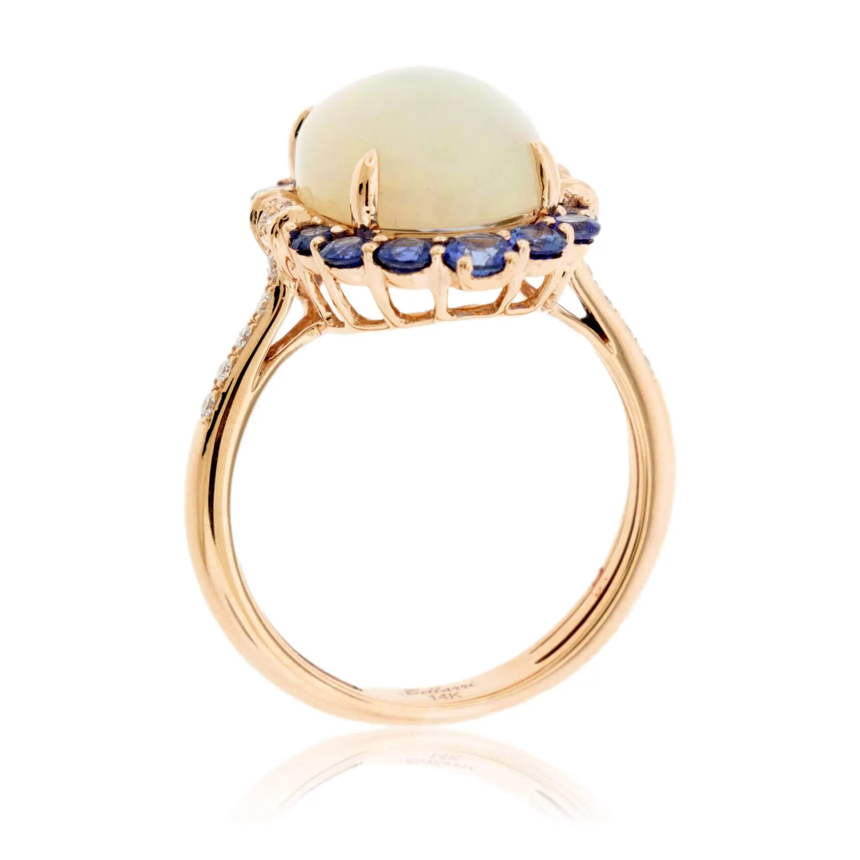 Oval Cabochon Opal Ring with Sapphire & Diamond Halo